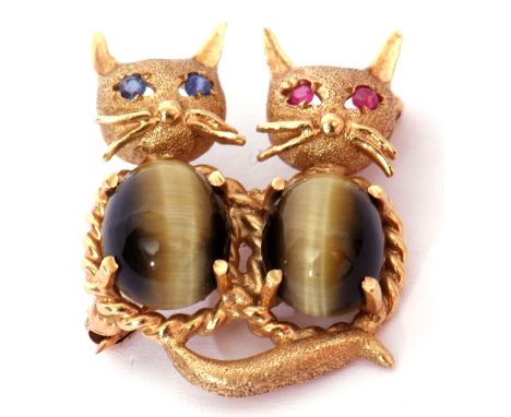 Vintage cat brooch, the textured 14K mount features two cats, both with cabochon tiger's eye bellies, with sapphire and ruby 