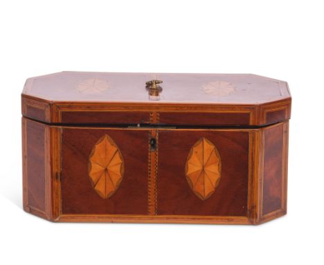 Sheraton style inlaid and mahogany tea caddy of canted rectangular form, the lid and front with two oval Sheraton style panel