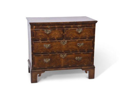 Late 18th century and later figured walnut and cross banded chest of two short over two long full width drawers with fitted b