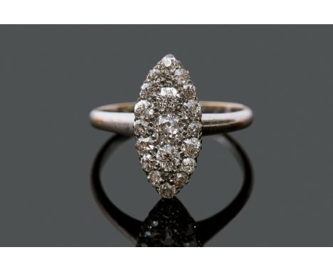 A precious metal diamond marquis shape cluster ring, set with graduating old cut diamonds, the principal diamond 0.15ct appro