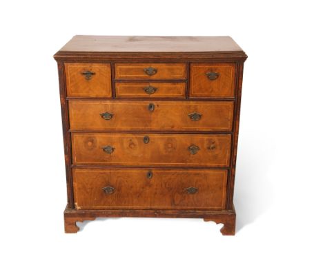18th century and later oak and walnut chest, two central shallow drawers flanked on either side by a deep drawer and three fu