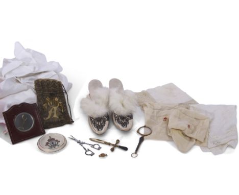 Royal memorabilia interest, collection of garments belonging to Queen Alexandra including a pair of stockings, two gowns, a p