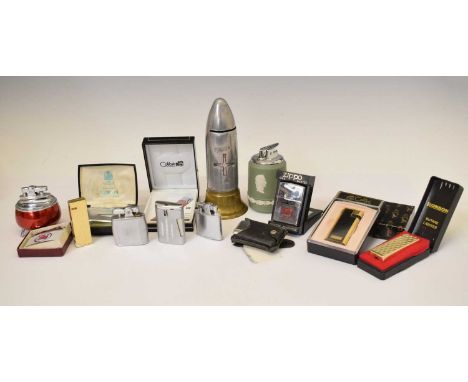 First World War trench art shell commemorative money box, 17cm high, together with a collection of lighters to include Wedgwo