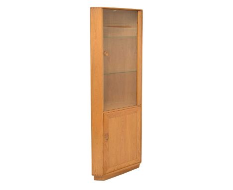 Ercol - Windsor elm corner unit, the glazed door upper section with two adjustable glass shelves, over single door cupboard b