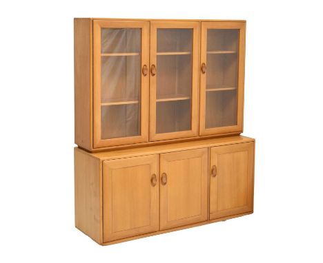 Ercol - Windsor elm display cabinet, the three glazed door upper section fitted with adjustable shelves, over three door cupb