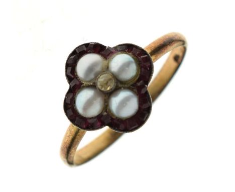 19th century ruby and pearl ring, the quatrefoil cluster having four split pearls with a border of calibre cut rubies, the ye