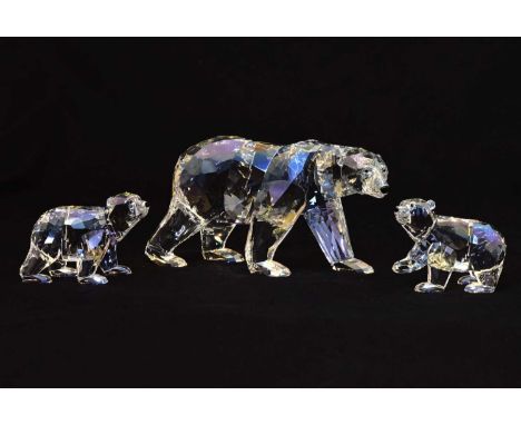 Swarovski Crystal Siku Polar Bear 2011, and two Swarovski Collector's Society polar bear cubs, 8.5cm high and smaller, with b