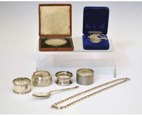 Quantity of silver to include four silver napkin rings, filed curb link chain, a silver Queen Victoria commemorative silver m