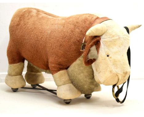 Attributed to Merrythought - Large 1960s ride-on Hereford Bull, the legs united by metal X frame with ball wheels, 104cm x 61