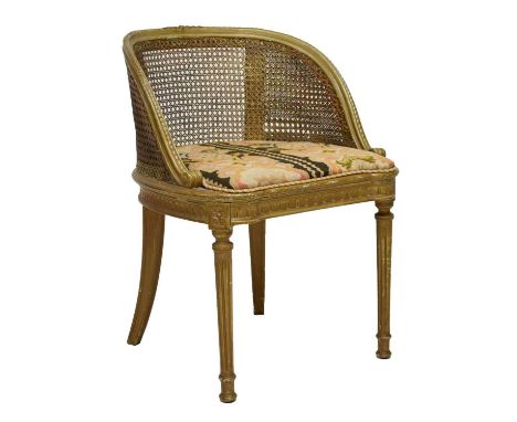 Early 20th century giltwood and caned bedroom chair with tapestry upholstered seat, raised on reeded front and spayed back le
