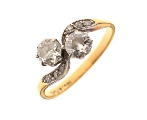 'Toi et Moi' diamond two-stone ring, the crossover band set with diamonds, stamped '18ct &amp; Plat', size M½ approx, 2.7g gr