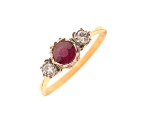 Ruby and diamond three stone ring, the stones illusion set in white metal, the yellow metal shank stamped '18ct Plat', size O