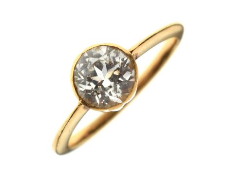 Two dress rings comprising a white stone solitaire ring, stamped 'K18' to the yellow metal shank, size M approx, 2.6g gross a
