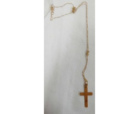 A SMALL 9CT CROSS ON FINE 9CT NECK CHAIN