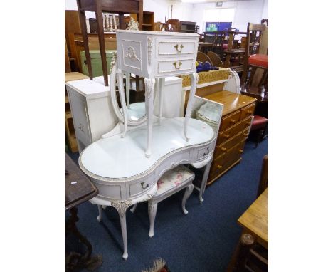 A CREAM AND GILT KIDNEY SHAPED DRESSING TABLE, stool, wall mirror, a pair of single headboards and a bedside chest of two dra