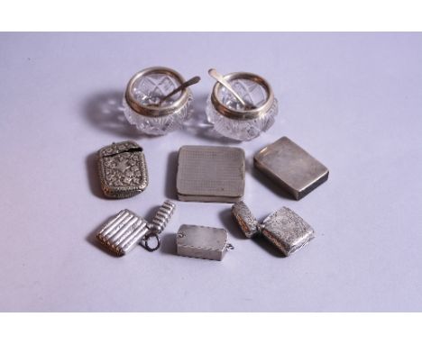 A FLUTED SILVER VESTA, Birmingham 1908, together with a silver vesta having scroll decoration, cartouche monogrammed A C Birm