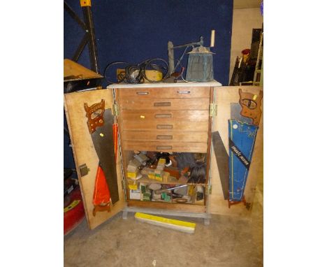 A PAINTED TWO DOOR TOOL CABINET, revealing six interior drawers containing a quantity of vintage hand tools and hardware incl