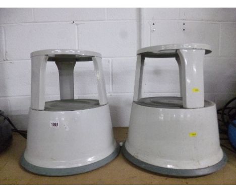 TWO METAL STEP STOOLS ON WHEELS