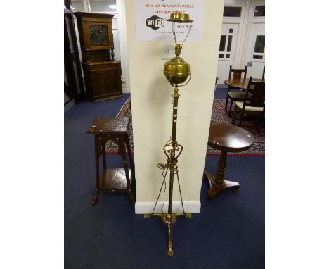 A BRASS AND COPPER TELESCOPIC OIL LAMP, with tripod base (converted to electricity, no shade)