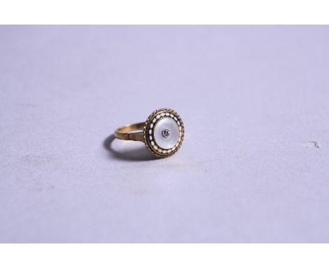 A YELLOW METAL DIAMOND MOTHER OF PEARL AND ENAMEL RING, ring size M, approximate weight 4.3 grams