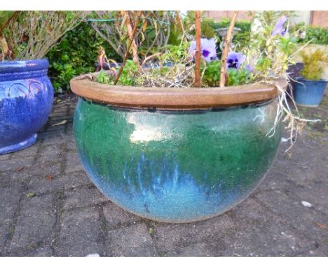 A LARGE BLUE/GREEN GLAZED STONEWARE PLANTER, approximate diameter 52cm