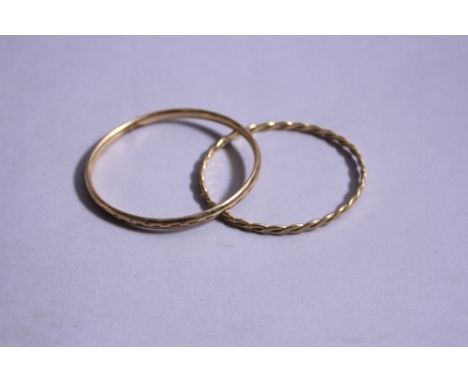 A 9CT BANGLE, approximate weight 14.2 grams, together with a metal case bangle (2)