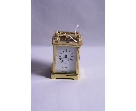 A BRASS CARRIAGE CLOCK (key)