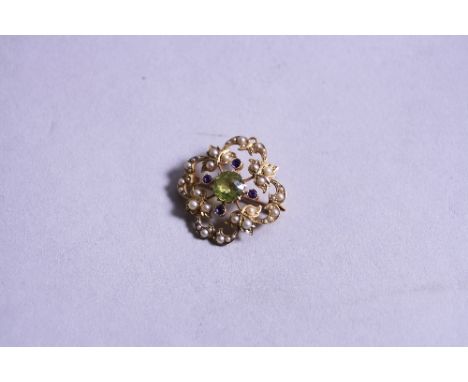 A 15CT AMETHYST, SEED PEARL AND PERIDOT BROOCH, approximate weight 5.3 grams