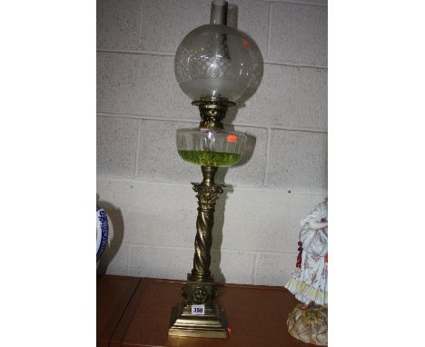 A VICTORIAN BRASS OIL LAMP, of Corinthian column form, lion mask detail, with glass shade, height approximately 56cm (not inc