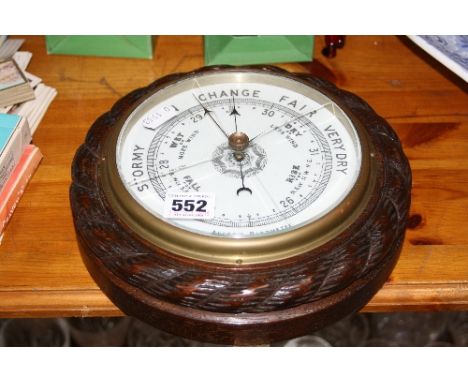 AN ANEROID BAROMETER, (glass cracked)
