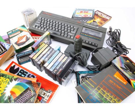 A Sinclair ZX Spectrum +2 Home Computer, with joystick, power cord, aerial cable and manual, plus a quantity of games and acc