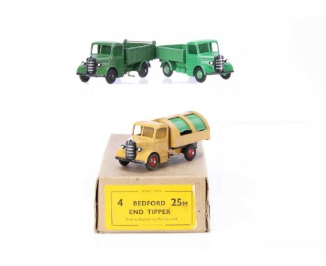 A Dinky Toys 25m Bedford End Tipper Trade Box, containing one example in dark green with black ridged hubs, with additional 2
