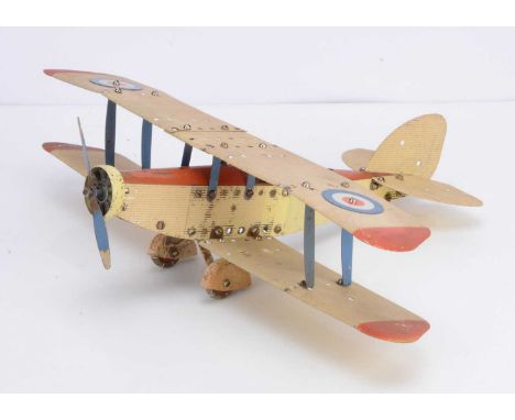 An unboxed built Meccano Airplane Constructor Export issue single engine Bi-Plane, in cream and orange with corrugated wings 