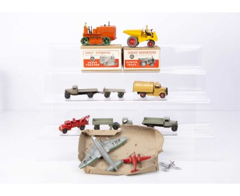 Dinky Supertoys 563 Heavy Tractor, 562 Dumper Truck, in original buff card boxes with loose 25e Tipping Wagon, 25c Flat Truck