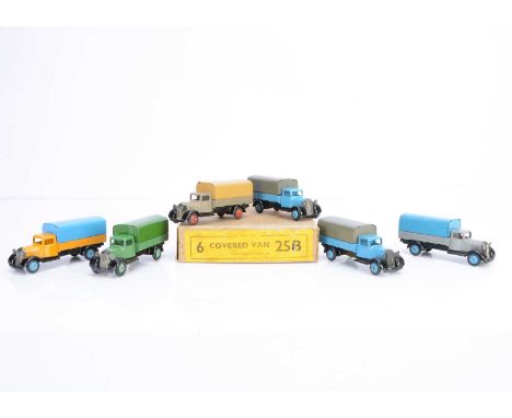 A Dinky Toys 25b Covered Van Trade Box, containing six examples, all type 4 moulded chassis, first yellow body, blue tilt and