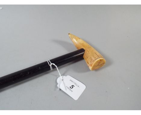A 19th Century Walking Stick with Whales Tooth Handle.