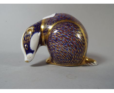 A Royal Crown Derby Badger Paperweight with Gold Button.