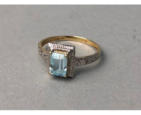 BLUE GEM SET RING, set with a central emerald cut pale blue gem, marked 375, size N 1/2, 1.4g