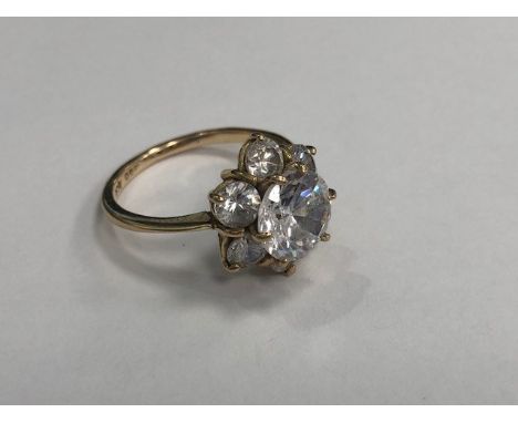 GEM SET FLOWER CLUSTER RING, set with round white gems, in nine carat gold, size R, 4.8g