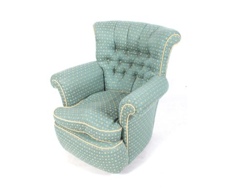 A mid button back feather squab seated arm chair. Upholstered in turquoise and gold patterned fabric, H80cm