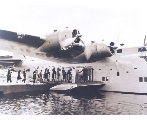 A framed print. Depicting a Pan Am flying boat. 60cm x 45cm, framed and glazed