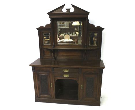 A Victorian mahogany sideboard dresser with mirrored back. Base section having two drawers with brass swing handles, above an