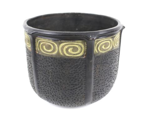 A Bretby Art Nouveau plannished effect terracotta jardiniere. Glazed in black and green with textured decoration, marked unde