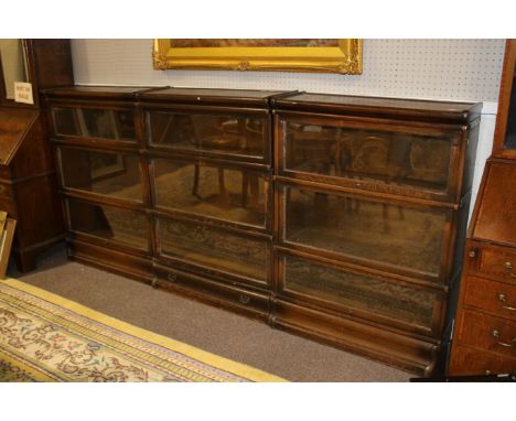 Globe Wernicke oak bookcases. Comprised of twelve sections (excluding the top most), making three glazed front matching banks