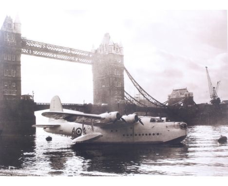 A print of a flying boat plane by Tower Bridge. 60cm x 45cm, framed and glazed