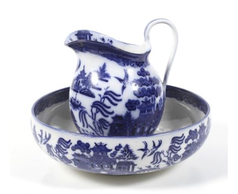 A Royal Doulton WIllow Pattern ceramic jug and basin. Basin diameter 37.5cm Condition Report: no chips or cracks. no sign of 