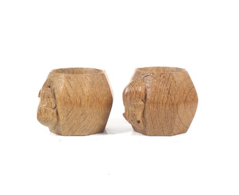 Robert 'Mouseman' Thompson of Kilburn, a pair of octagonal oak napkin rings. Both with the carved mouse signature, H4.5cm Con