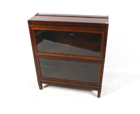 A Globe Wernicke 'Universal' elastic bookcase. Size 813.  Mahogany, glazed, two sections and plate stand section to top. On t