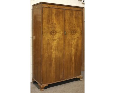 A vintage Waring & Gillow burr walnut double wardrobe. Circa 1930, the doors opening to reveal an interior mirror and a cloth