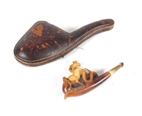 A late 19th/early 20th century meershaum pipe carved with a horse trampling a snake. In a fitted leather case, the case appro